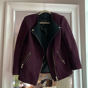 Moto style jacket. Will like material. Just needs a little dust bunny removal.